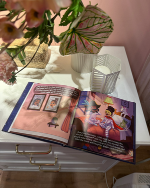 When I'm Afraid on a child's nightstand. Open book on a white surface with decorative elements including flowers and candles.